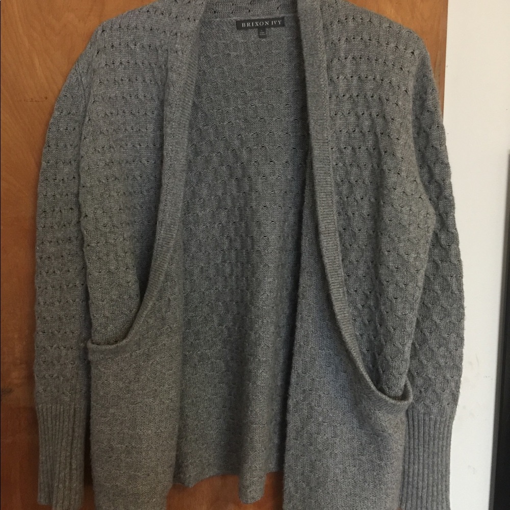 A grey women’s knit cardigan